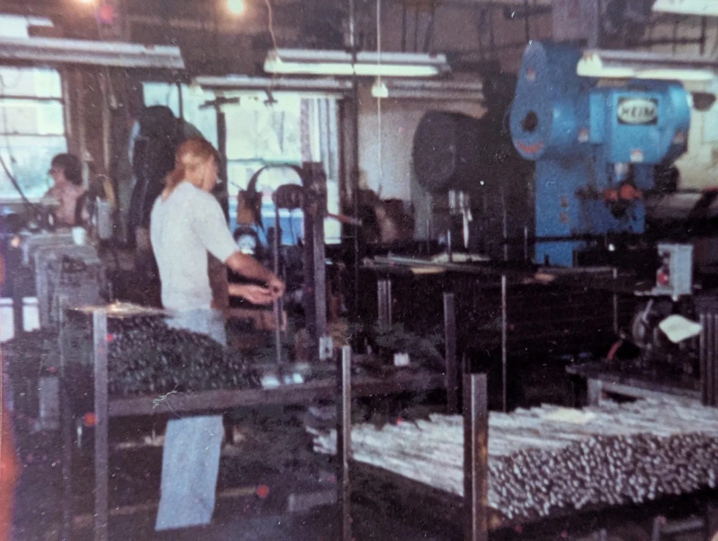 An archival view of people working among shop machinery