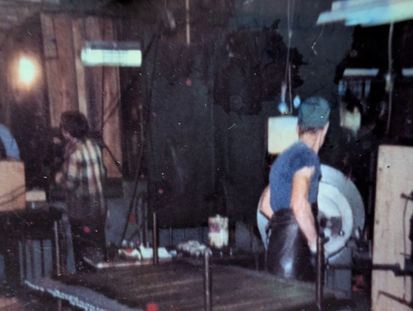 People operating production equipment in the historic shop
